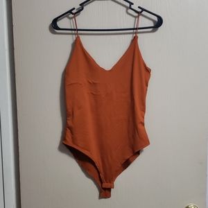 Orange body suit